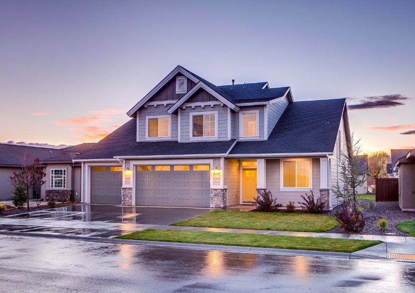 grey-and-white-home-with-street-and-yard